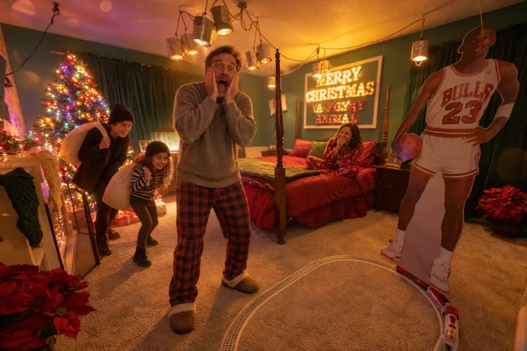 A dad screams in mock surprise as the kids sneak up in Home Asleep, the year-round Christmas bedroom at Electronic Ice Castle
