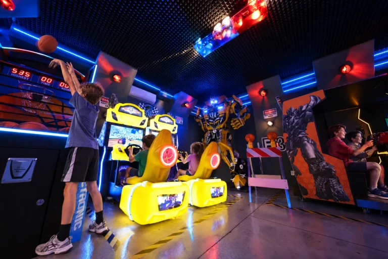 Cousins play basketball, racing games and air hockey all at once in the Robot Game Room at Electronic Ice Castle