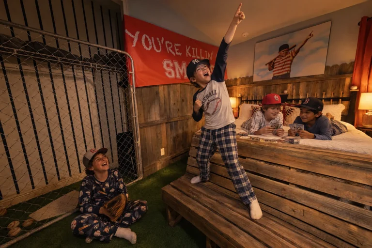 Cousins in baseball caps have a sleepover in The Slumber Lot, the sandlot baseball bedroom at Electronic Ice Castle