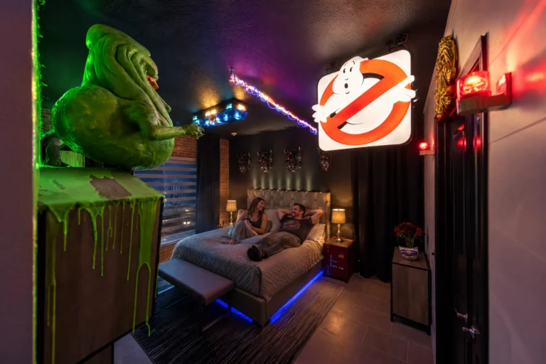 Parents relax in Snoozebusters, the ghost-hunter themed primary suite at Electronic Ice Castle