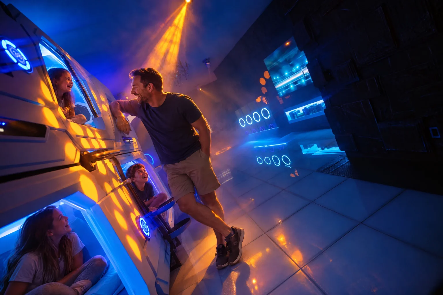 Dad says goodnight to the kids in their glowing bunk pods in The Grid at The Iron Mansion